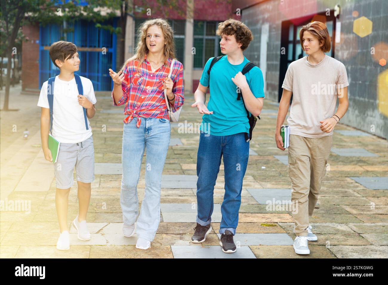 School friends walk after class Stock Photo - Alamy