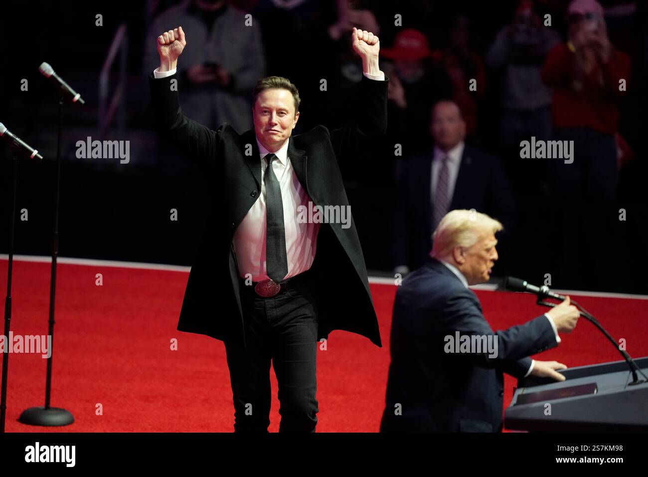 Elon Musk reacts as Presidentelect Donald Trump speaks at a rally