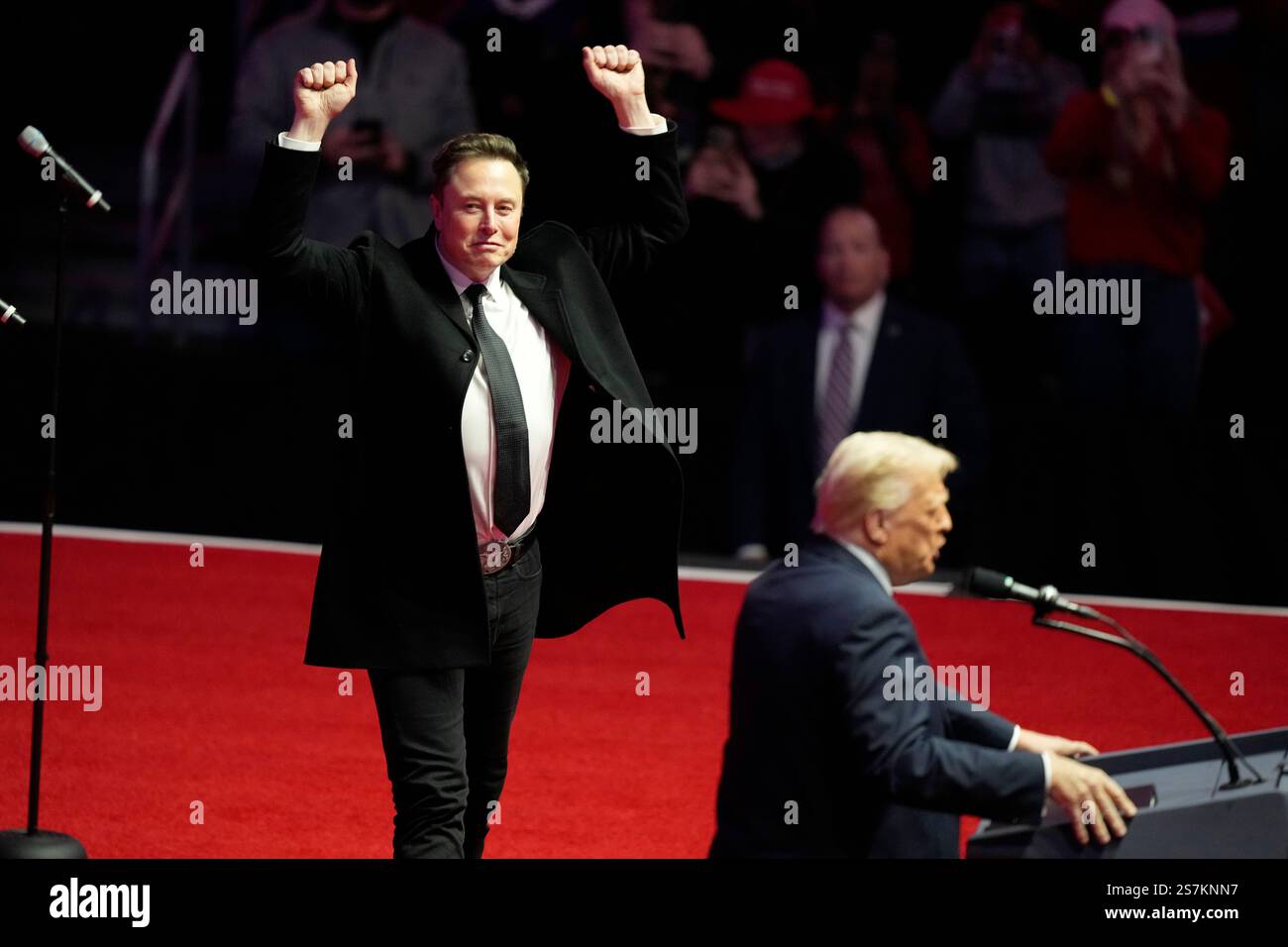 Elon Musk reacts as Presidentelect Donald Trump speaks at a rally