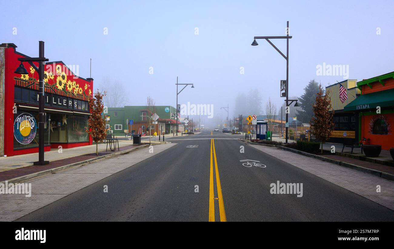 Carnation, WA, USA - January 18, 2025; Misty winter morning cityscape view northbound through City of Carnation Stock Photo