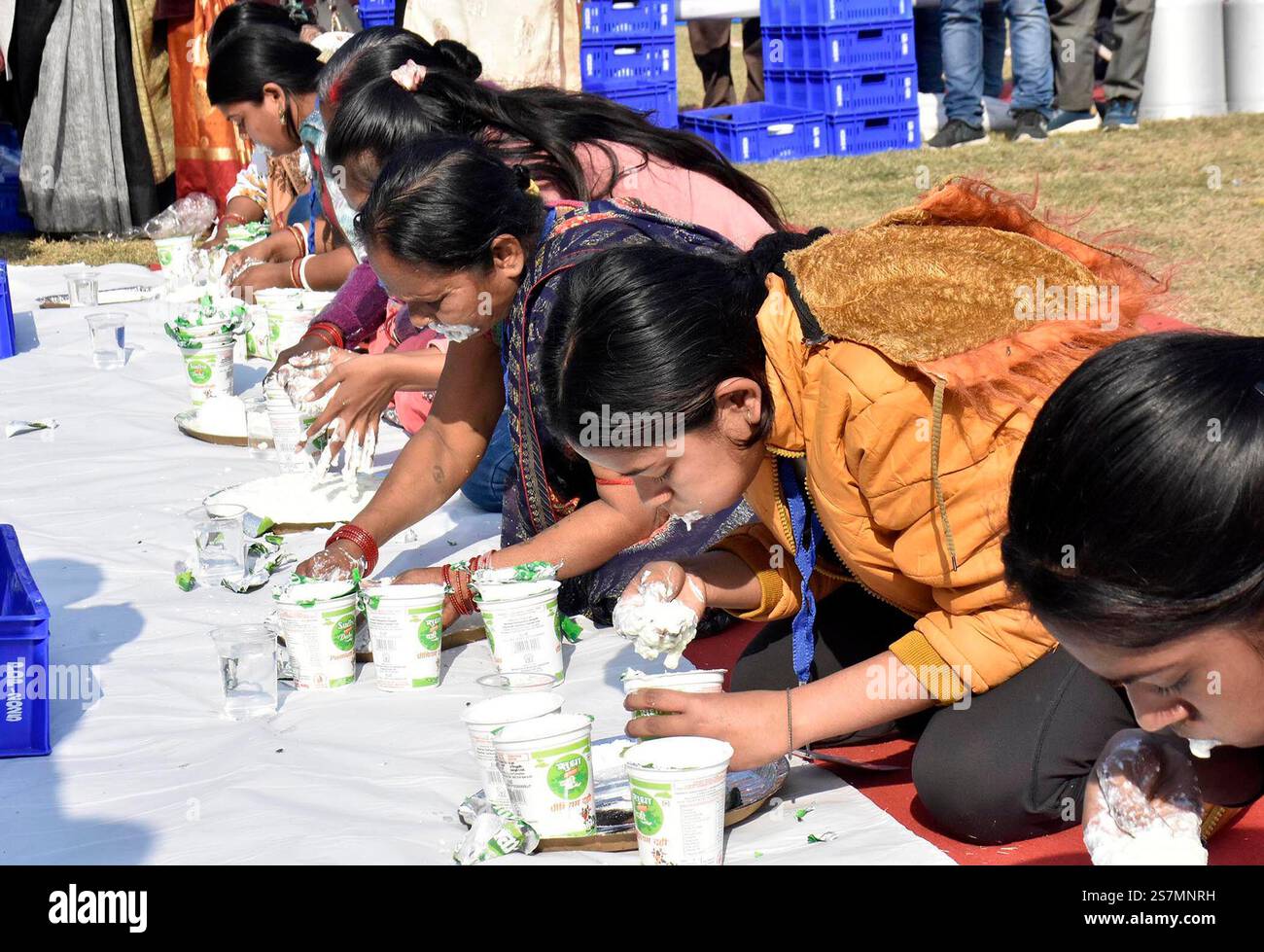 PATNA, INDIA JANUARY 18 Participants eating curd during 'Dahi Khao