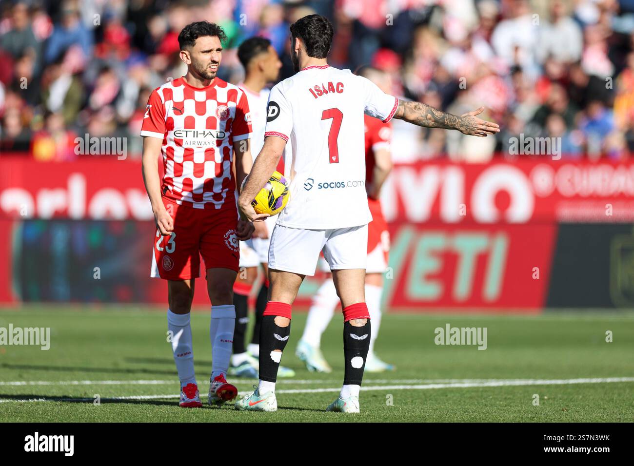 Isaac Romero of Sevilla FC and Ivan Martin of Girona FC during the La ...