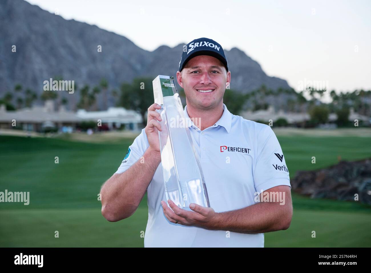 Sepp Straka holds the trophy after winning the American Express golf