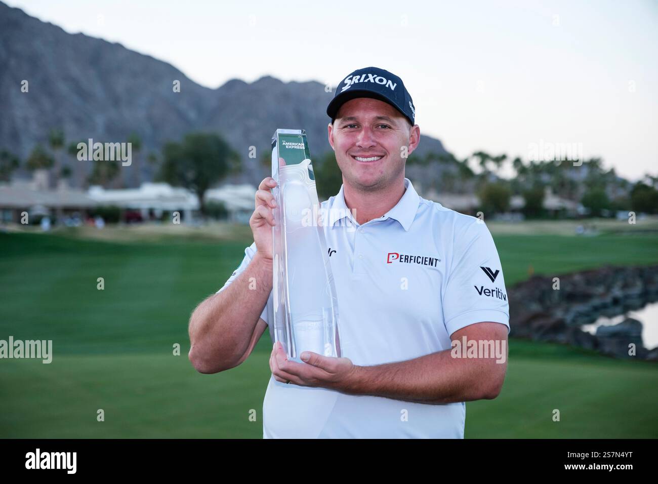 Sepp Straka holds the trophy after winning the American Express golf