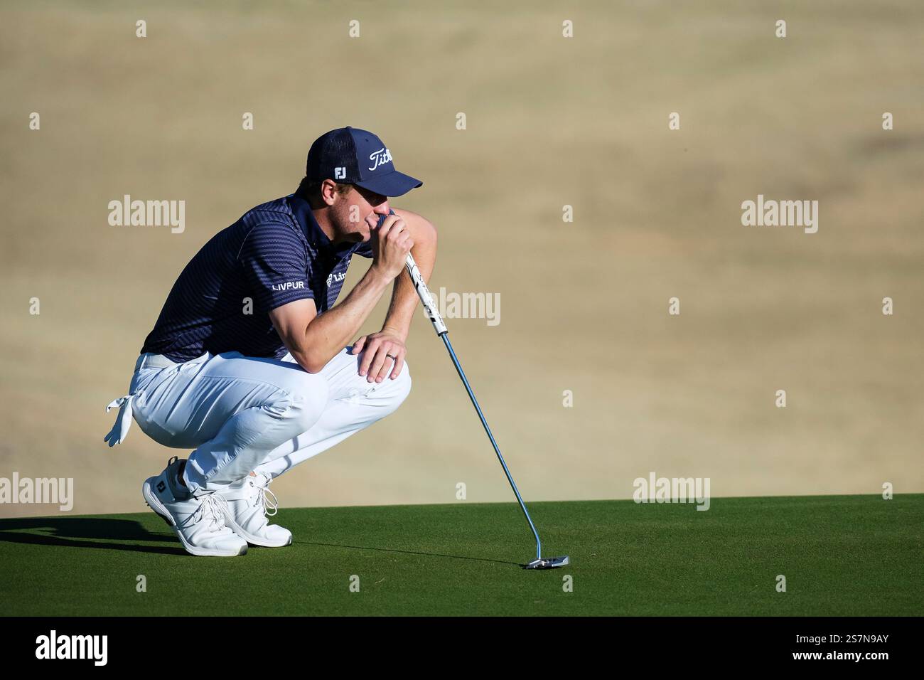 Justin Thomas prepares to putt on the 16th green at the Pete Dye