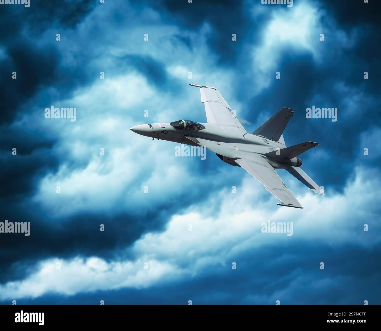 American Fighter Jet Flying Through Dramatic Clouds Stock Photo - Alamy