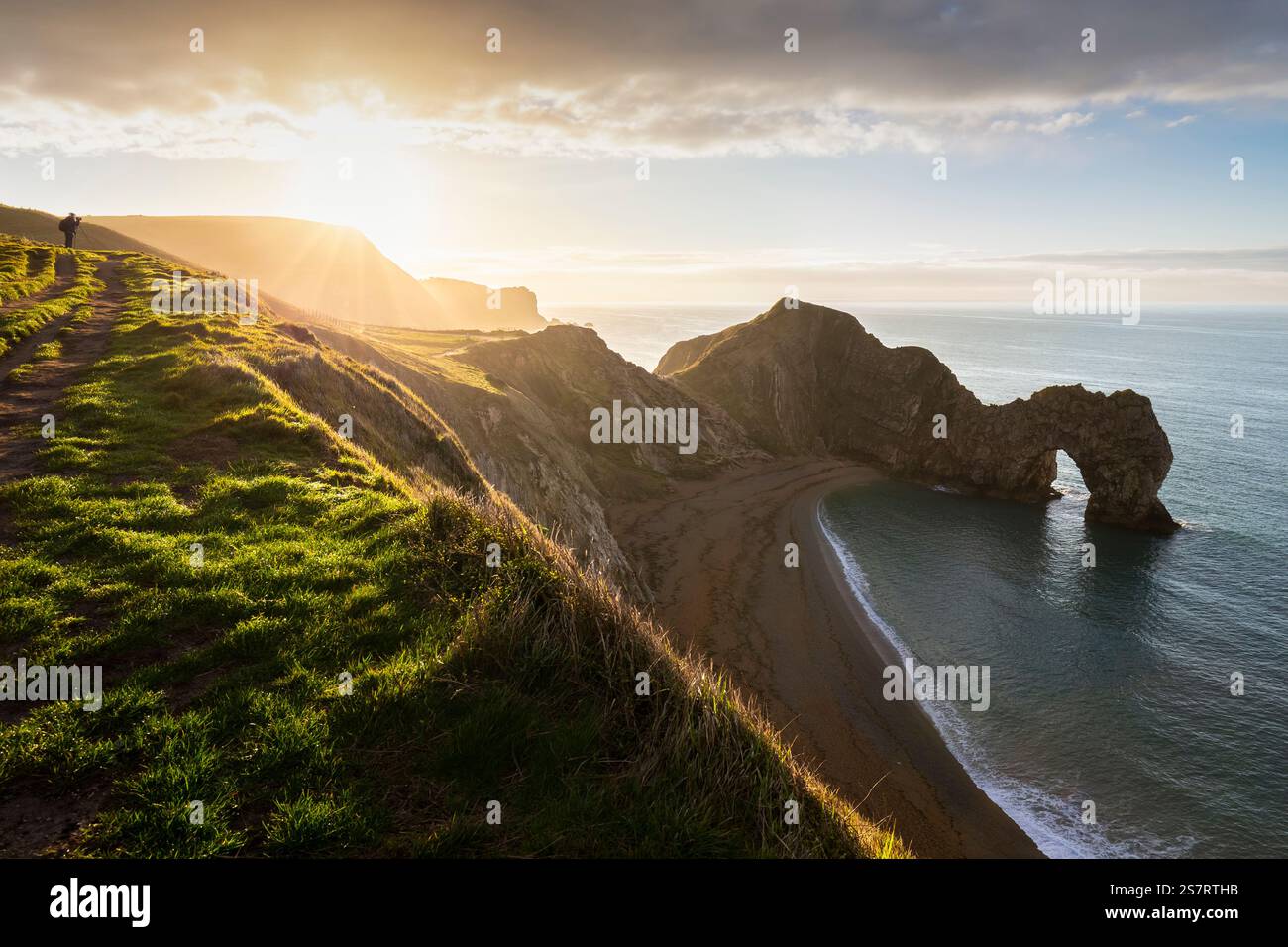 View at sunrise of the Durdle Door, a natural limestone arch on the Jurassic Coast near Lulworth in Dorset, Southern England. Stock Photo