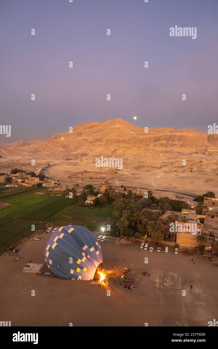 pre-dawn inflation of hot-air balloon, Thebes, Luxor, Egypt Stock Photo