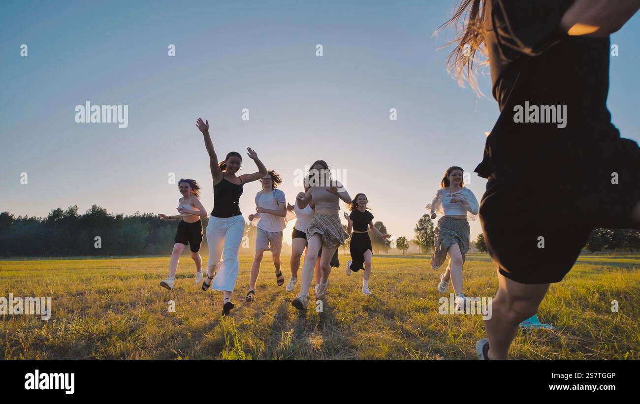 In Their Field High school students enjoying their summer vacation by running together ...