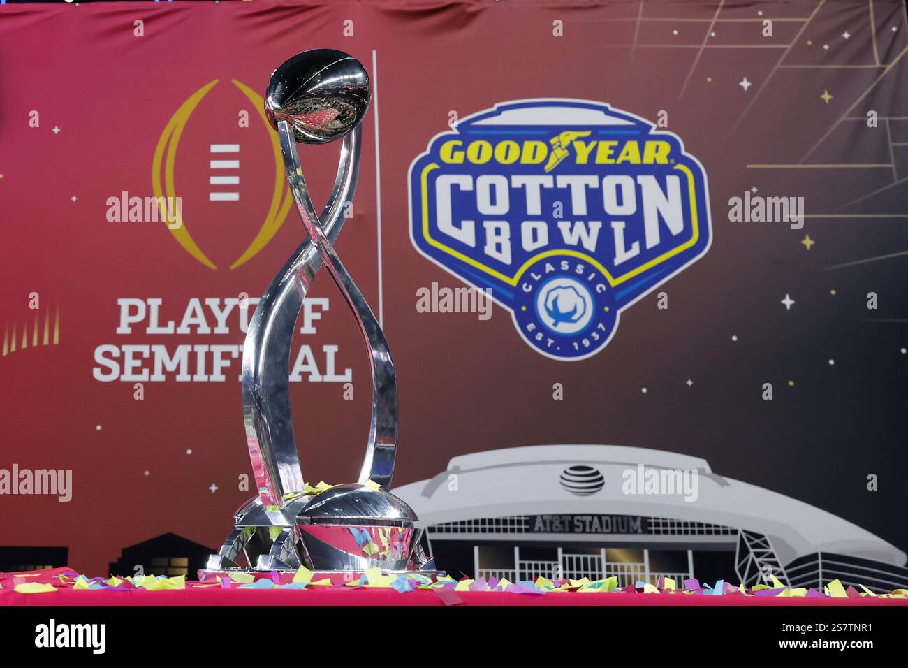 the Goodyear Cotton Bowl trophy sits on a table among confetti after