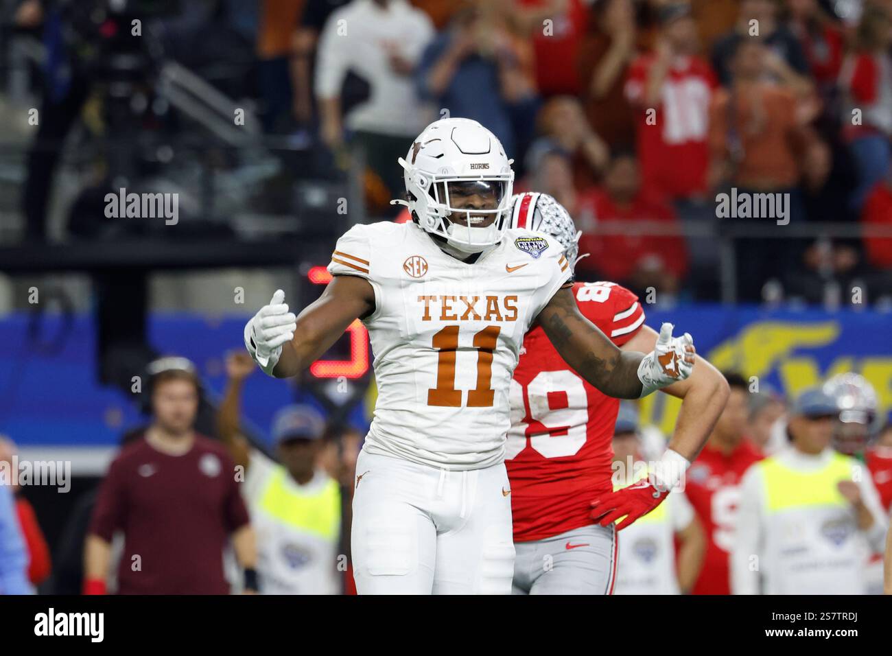 Texas linebacker Colin Simmons (11) celebrates after a play during the