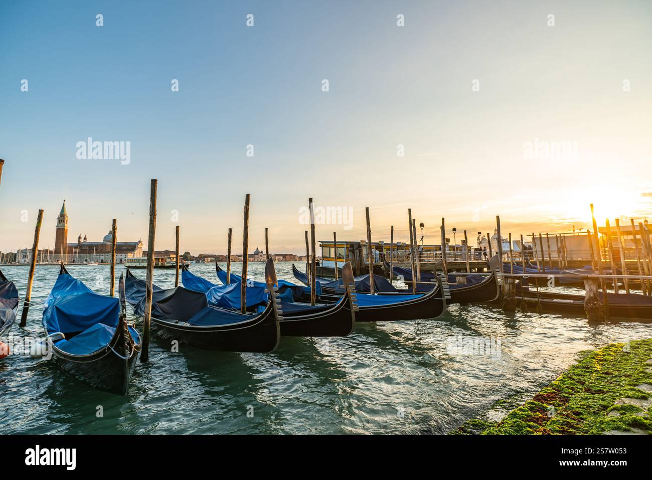Gondolas in Venice at Sunset: A Serene View Stock Photo - Alamy