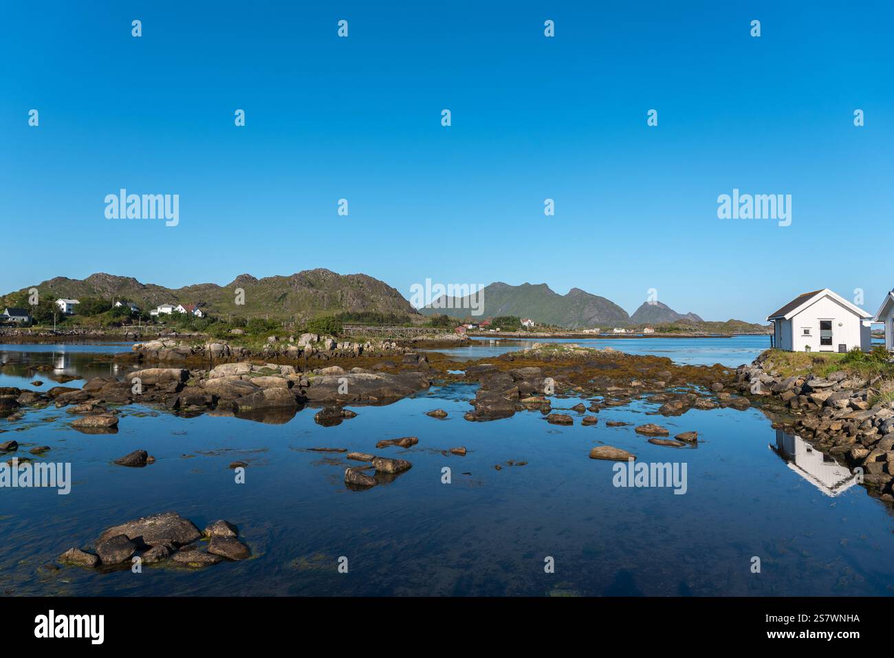 Landscape and townscape with view over Skotnesosen Bay, Ballstad, Lofoten, Norway, Europe Stock Photo