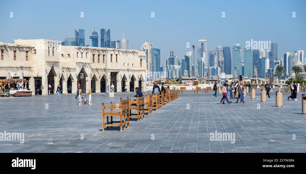 Doha, Qatar - January 4, 2025: A lively public square in front of Souq Waqif, where the vibrant energy of Doha shines through the interactions of loca Stock Photo