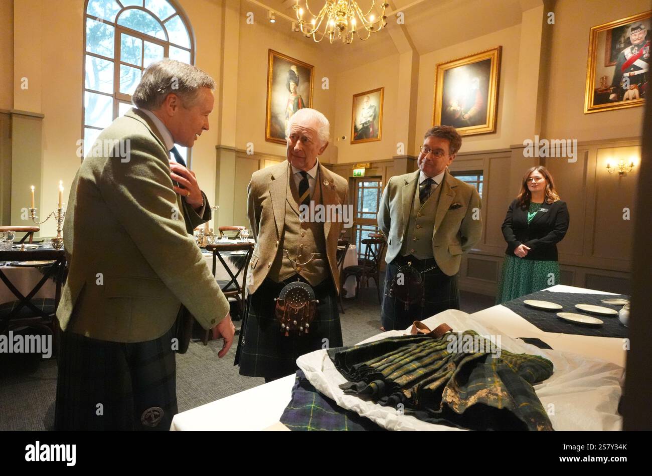 King Charles III meets Alexander 'Sandy' Manson (left) as they view a ...