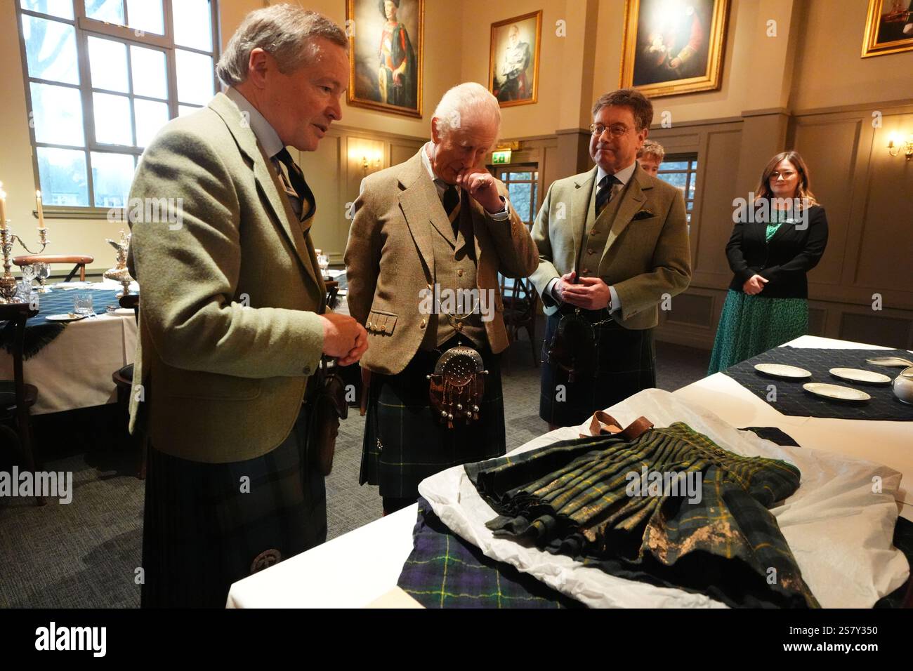 King Charles III meets Alexander 'Sandy' Manson (left) as they view a ...