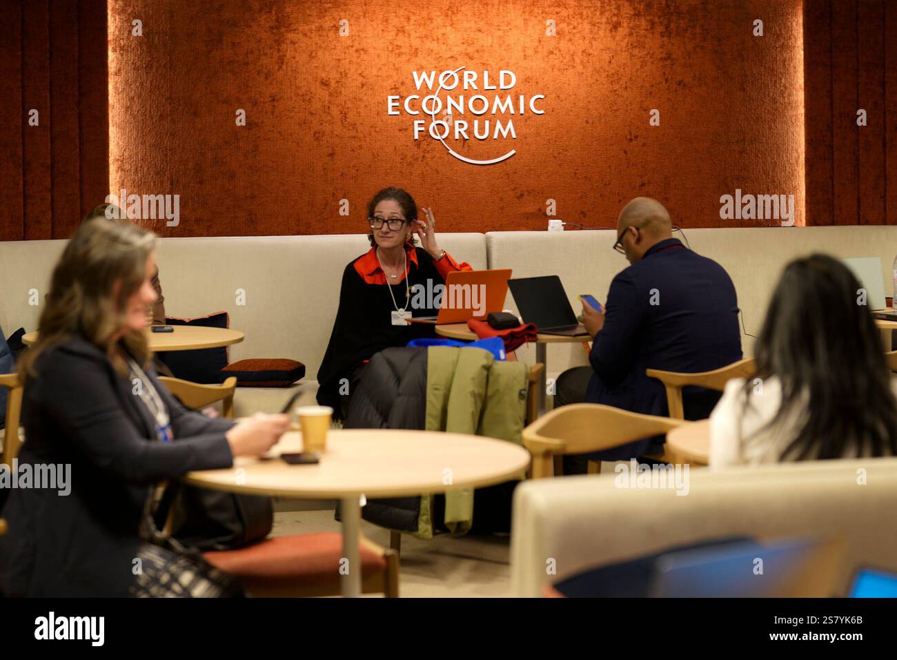 Markus Prior People take a break inside the congress center prior to the official ...