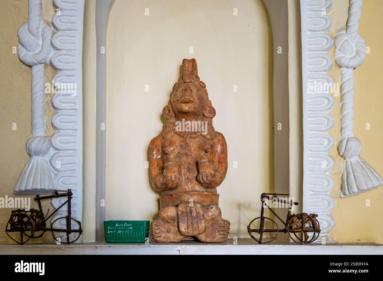 Traditional Mayan terracotta figure in a prayer post. Antiqua, Guatemala, Central America. Stock Photo