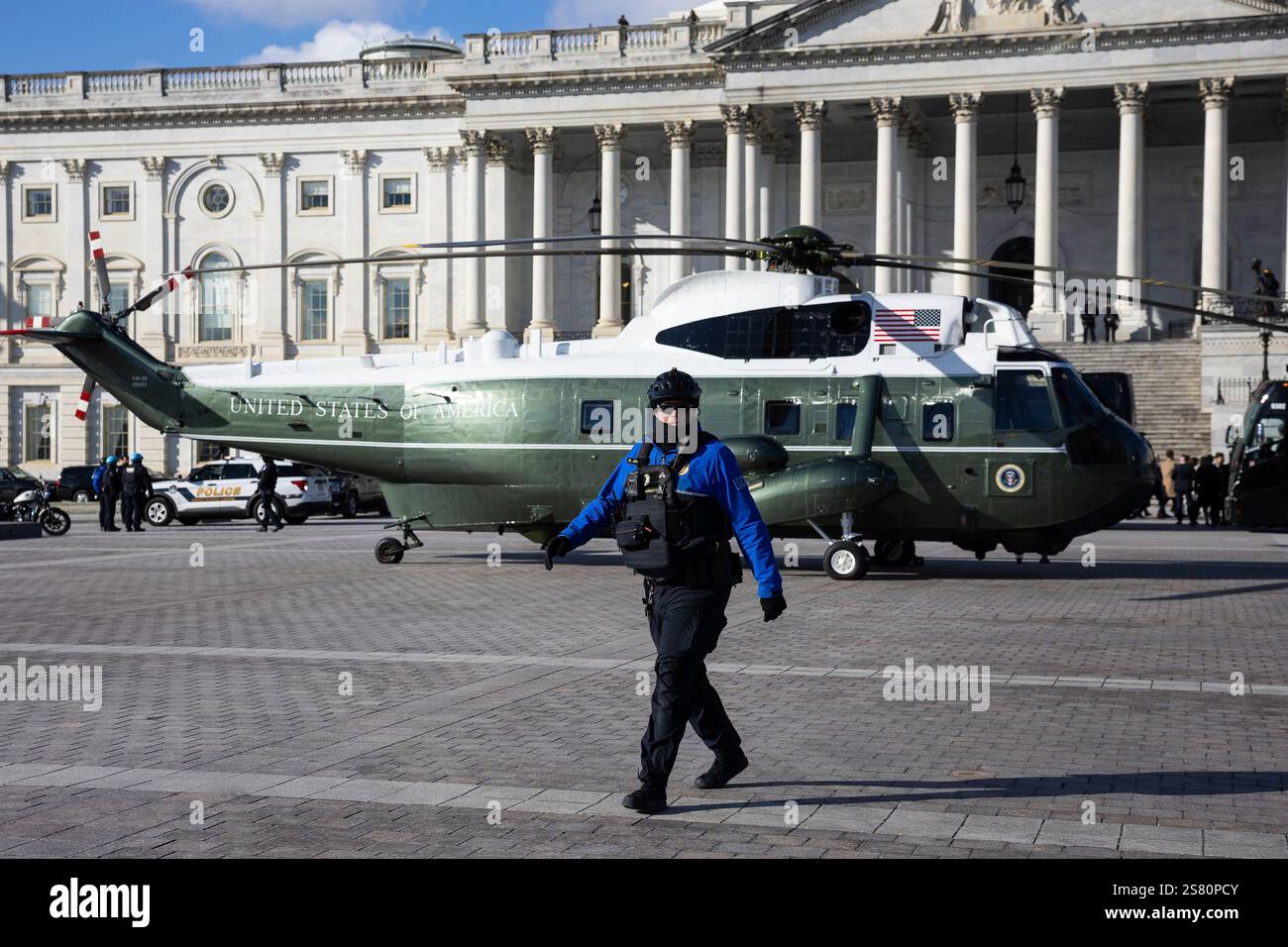 A U.S. Capitol Police officer walks past Marine One outside the U.S ...