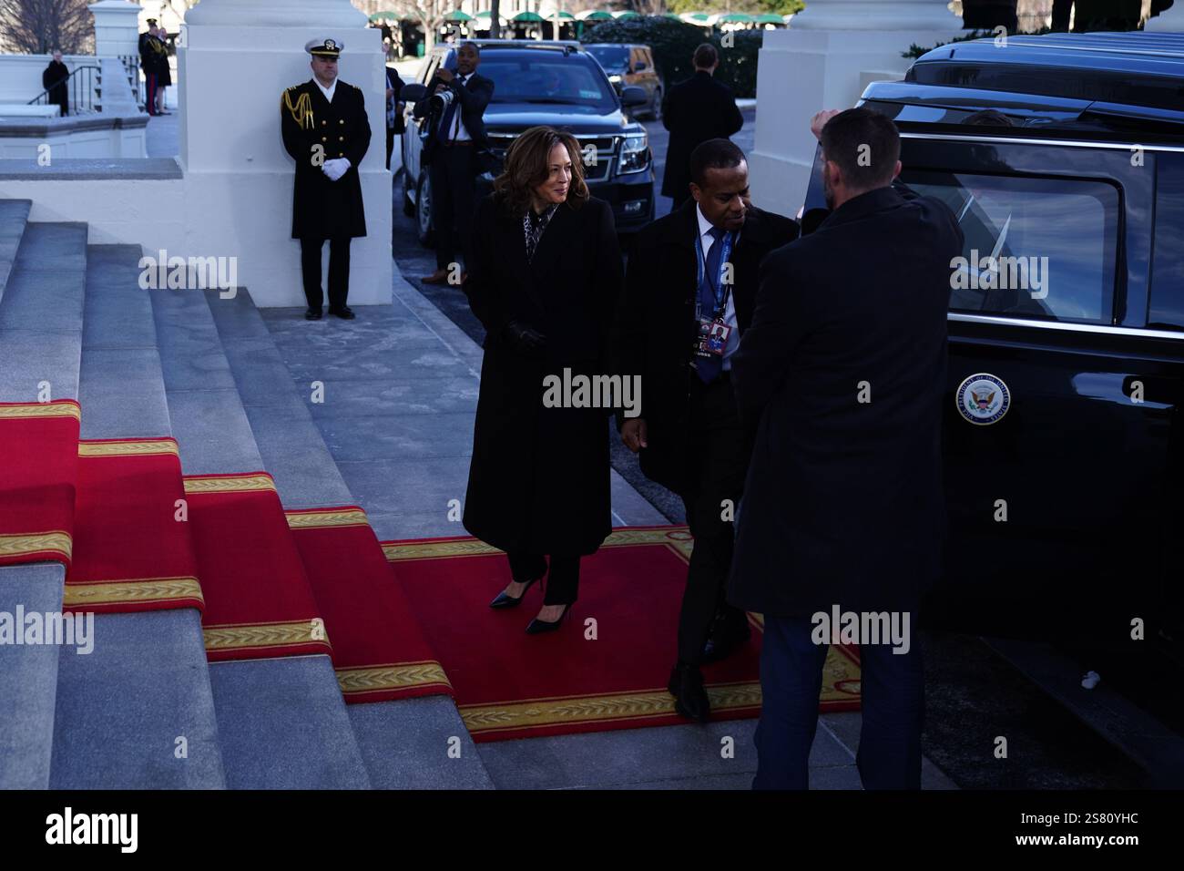 Vice President Kamala Harris (L) arrives at the White House in