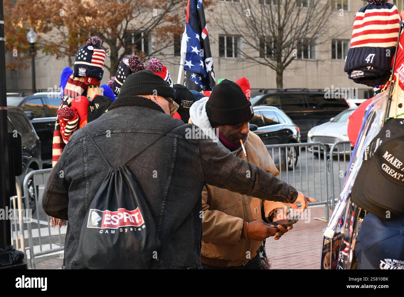 Vendors sell Trump themed merchandise to the crowds lining up outside