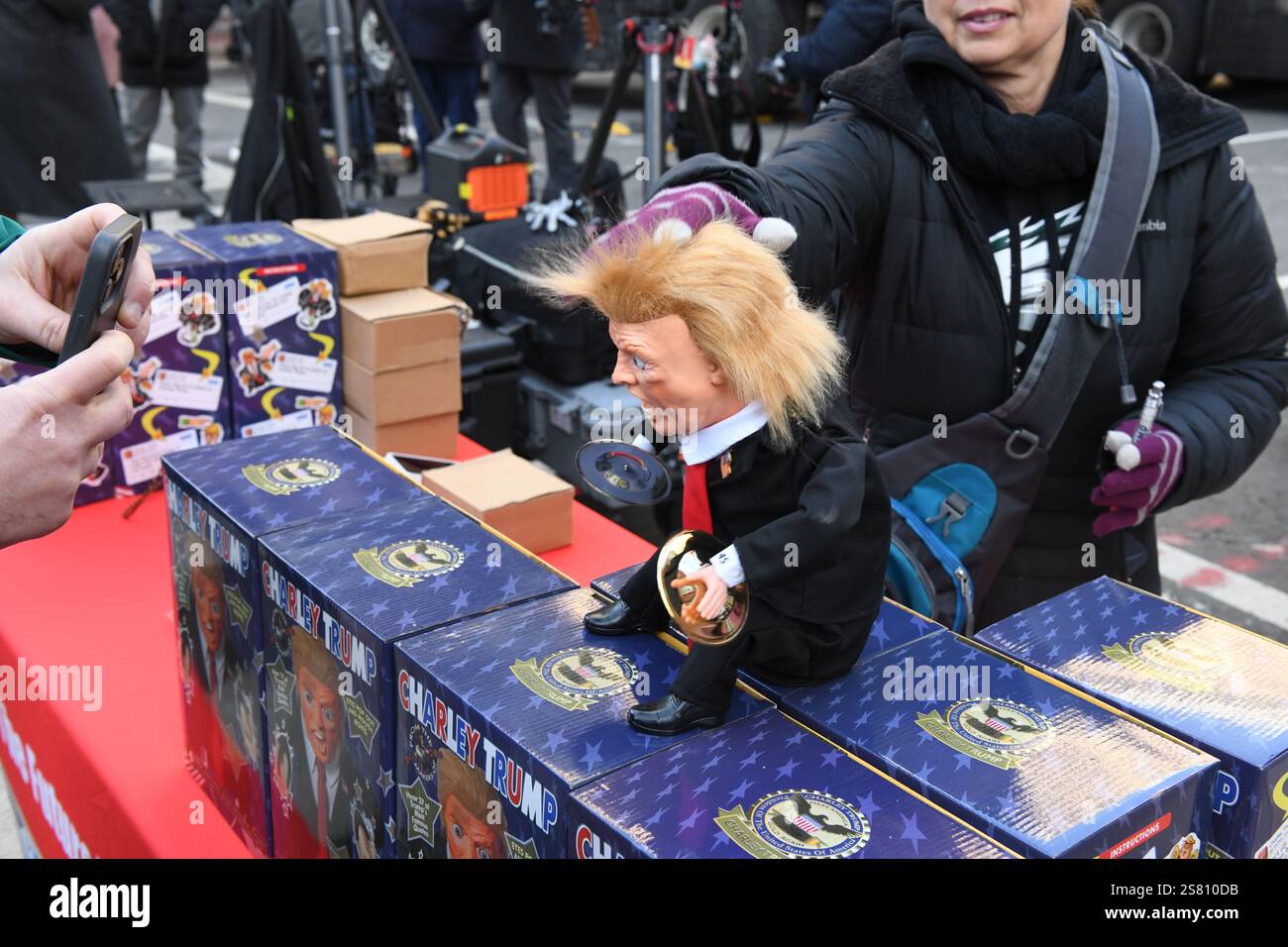 Vendors sell Trump themed merchandise to the crowds lining up outside