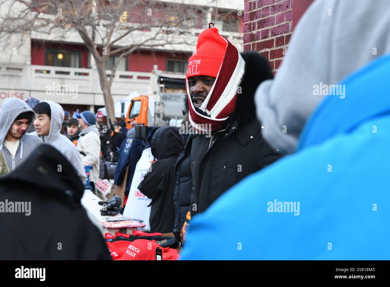 Vendors sell Trump themed merchandise to the crowds lining up outside