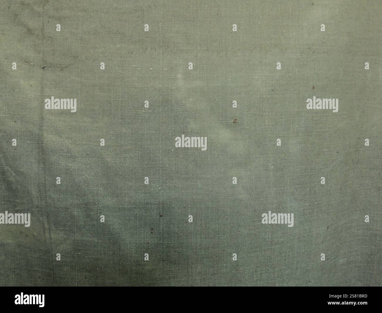 texture of rough tarpaulin fabric dirty green color close-up, fabric ...