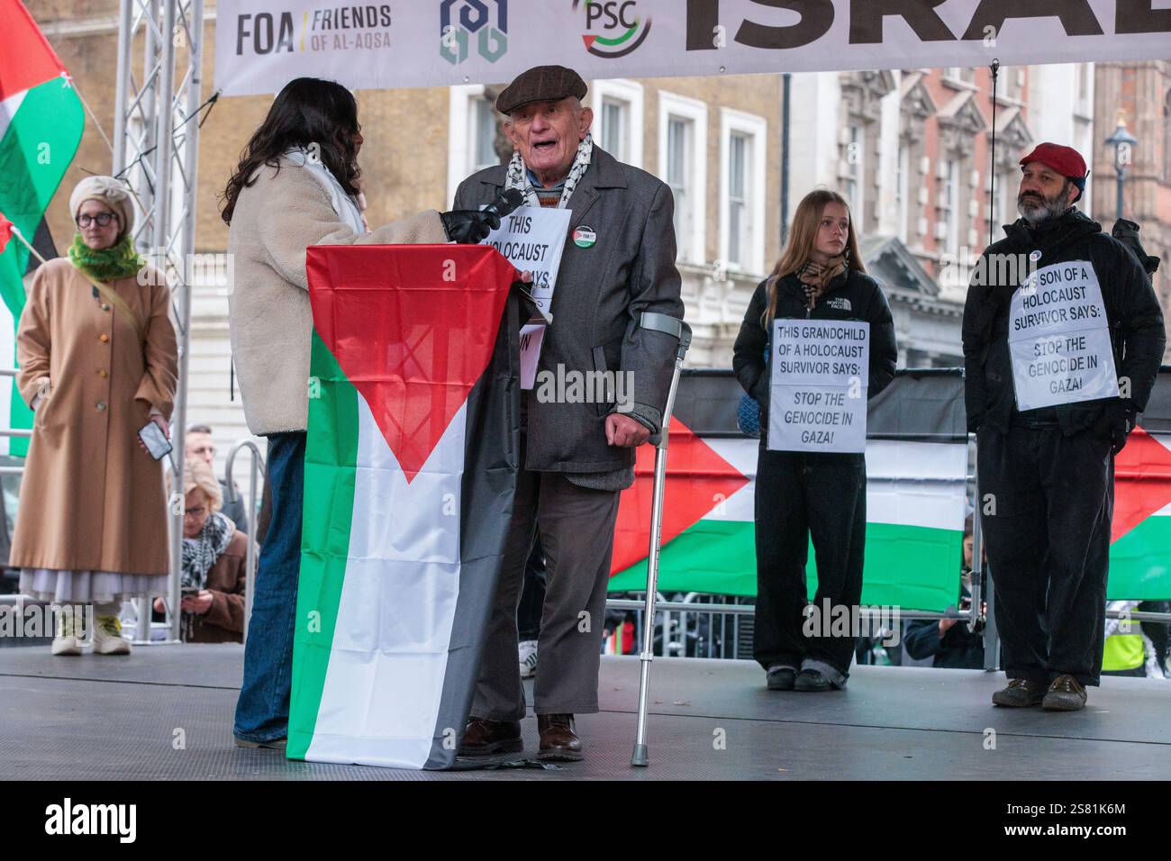 London, UK. 18th January, 2025. Holocaust survivor Stephen Kapos, seen here with members of his family, addresses pro-Palestinian demonstrators taking part in a National March for Palestine event. The event was switched to a static rally in Whitehall by the organisers after the Metropolitan Police imposed conditions prohibiting a march starting from the BBC intended to highlight perceived pro-Israel bias in the public broadcaster's reporting of events in Gaza. Credit: Mark Kerrison/Alamy Live News Stock Photo