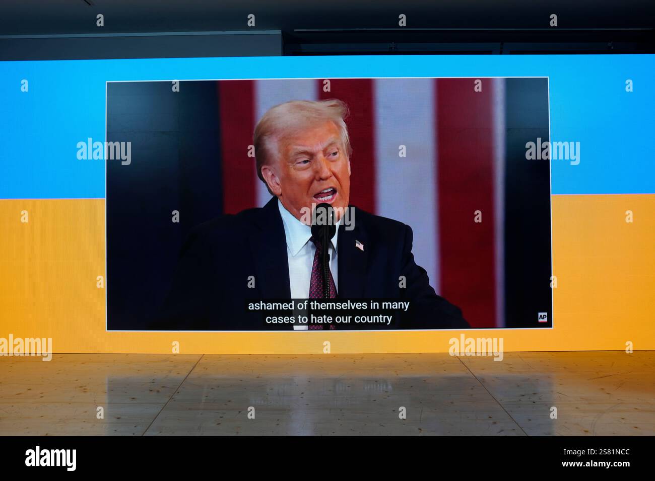 The inauguration speech of Donald Trump is shown on screens at the