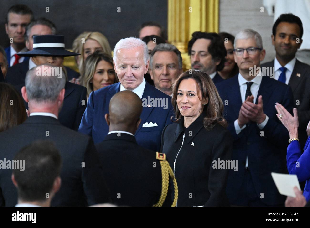 US President Joe Biden and Vice President Kamala Harris arrive for the ...