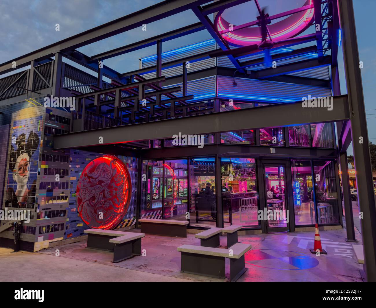 Pink and blue lights brighten The Rice Box, a futuristic  looking restaurant that serves Asian American food, Houston, Texas, USA. - Smartphone Captured Stock Image