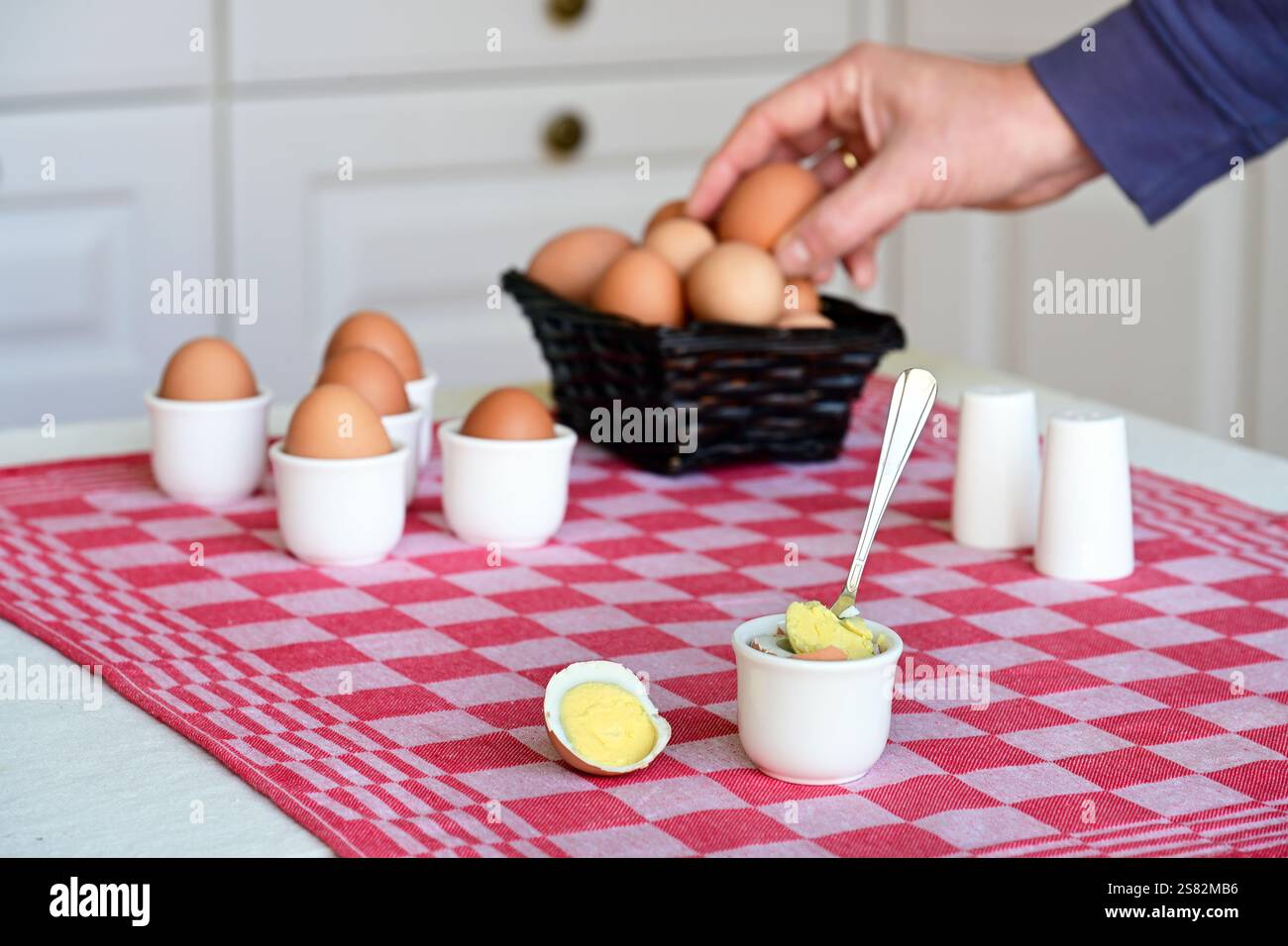 Soft-boiled egg on a set breakfast table Stock Photo