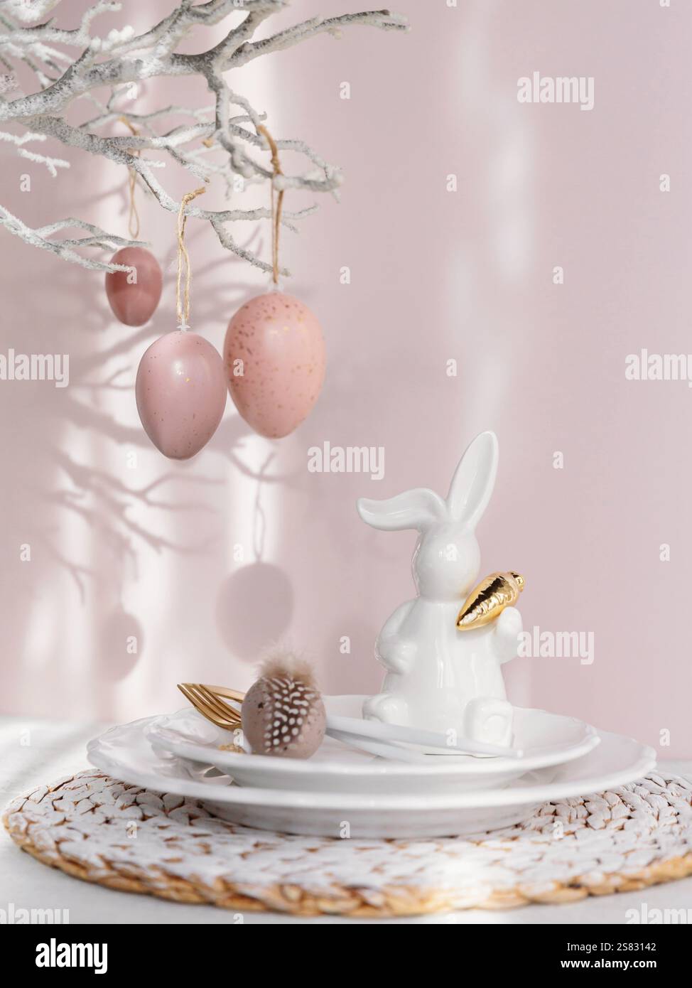 Easter Bunny Figurine With Table place setting Stock Photo