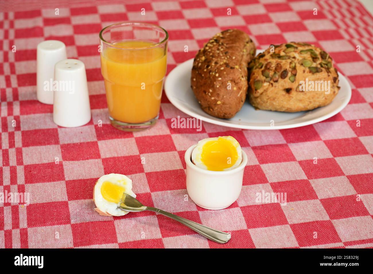 soft-boiled egg on a set breakfast table Stock Photo