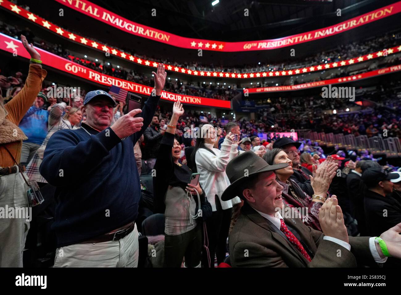 People cheer for Elon Musk at an indoor Presidential Inauguration