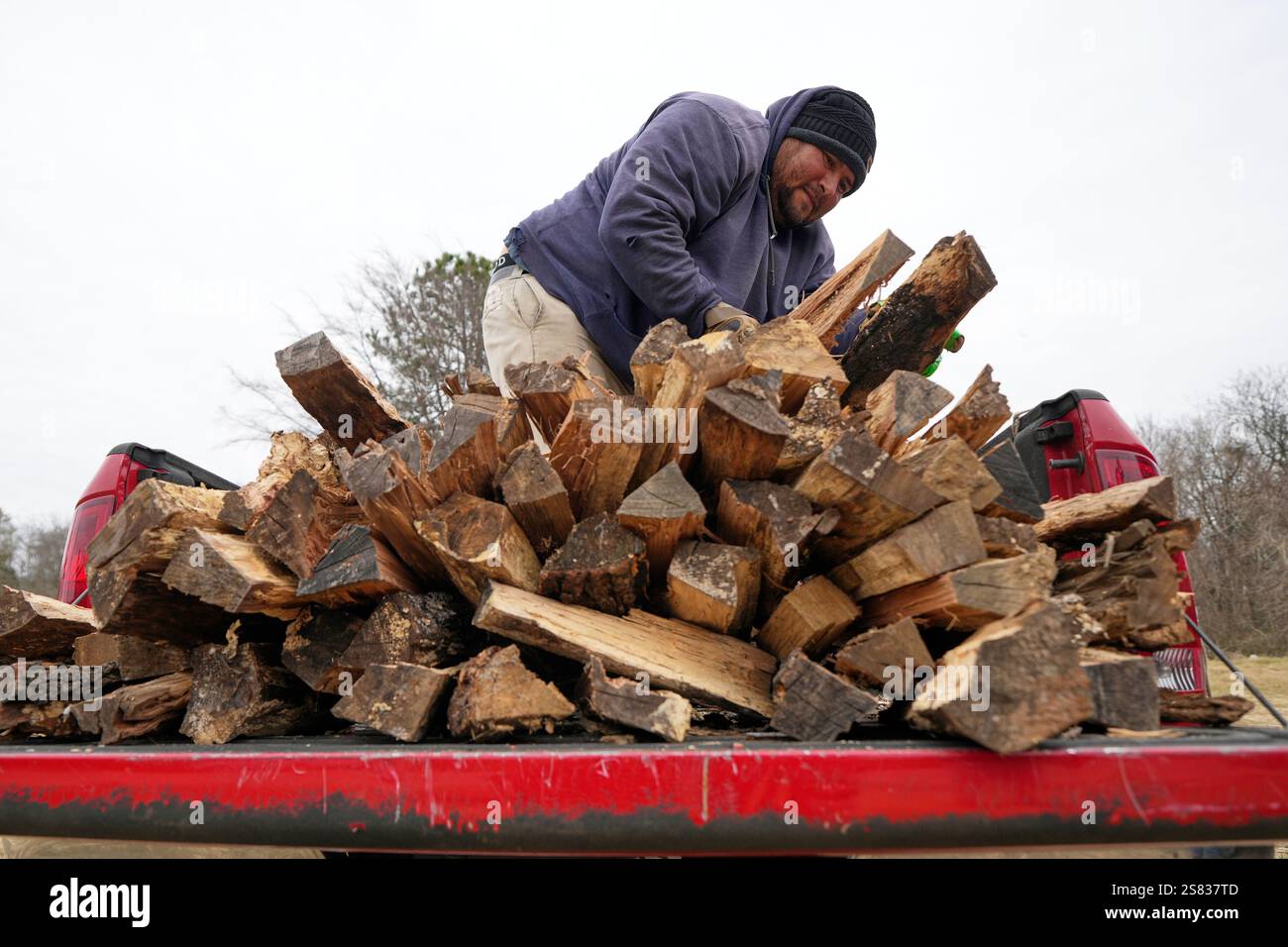 William Amaya sells firewood out of his pickup truck Monday, Jan. 20