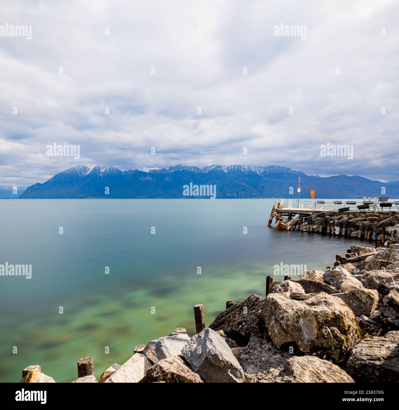 Lake Geneva on a sunny day, captured in a long-exposure photo with a polarizing filter Stock Photo