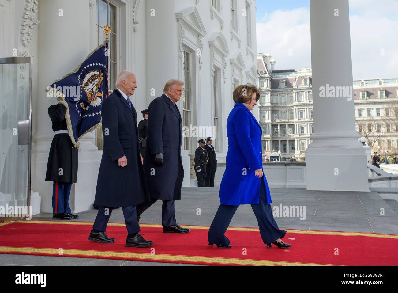 Sen. Amy Klobuchar, D-Minn.; President Joe Biden; and President-elect Donald Trump depart the