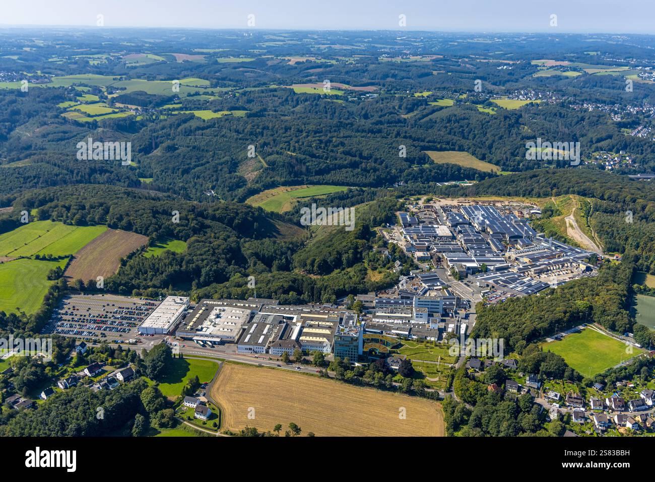 Aerial view, Siegfried Jacob Metallwerke GmbH factory premises with solar panel, forest area with forest damage, dormakaba Deutschland GmbH factory pr Stock Photo