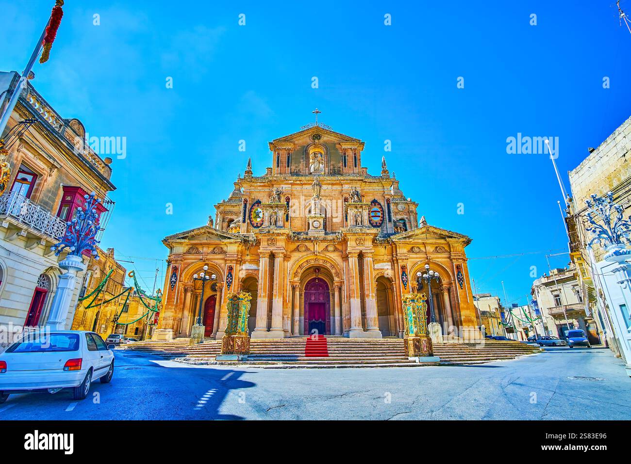 The scenic facade of the Parish Church of St Nicholas of Bari, decorated with garlands and lanterns due to the Feast of St Nicholas - the patron Saint Stock Photo
