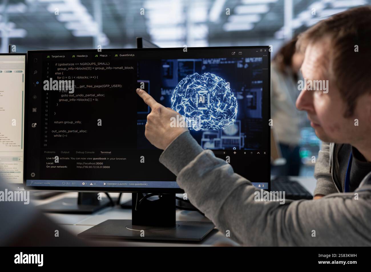 Manager overseeing programmers using artificial intelligence technology to optimize data center. Supervisor checking progress done by worker in server hub using AI tech to streamline operations Stock Photo