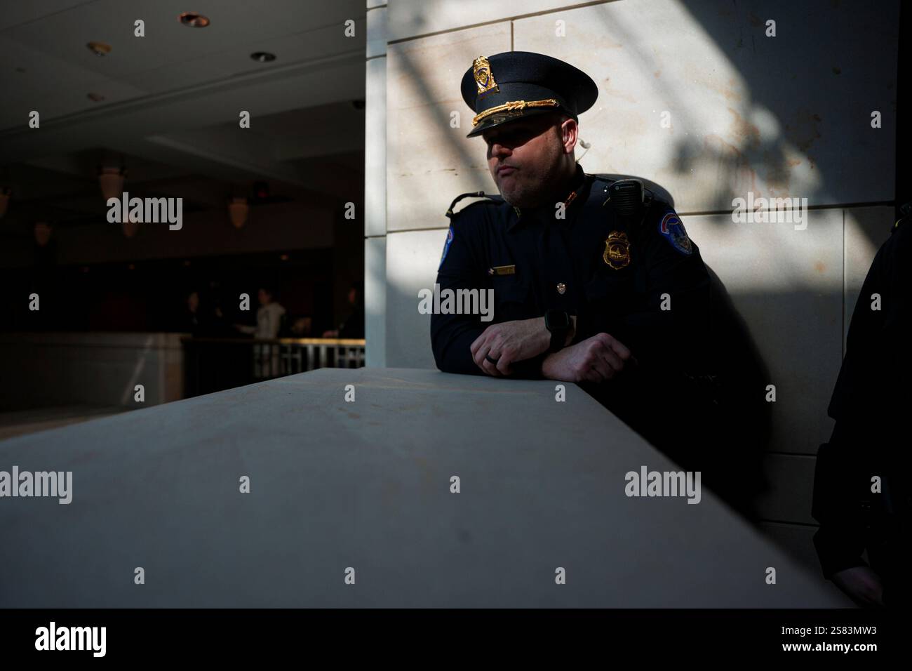 A Capitol Police officer listens as President Donald Trump delivers ...