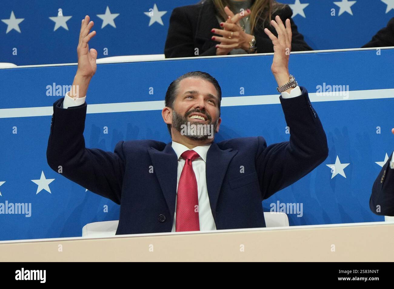 Donald Trump Jr. arrives at an indoor Presidential Inauguration parade