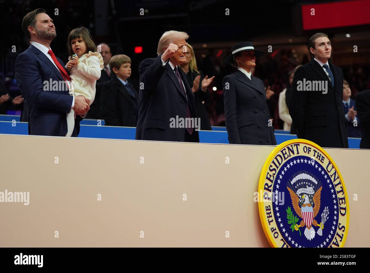 President Donald Trump attends an indoor Presidential Inauguration parade event at Capital One