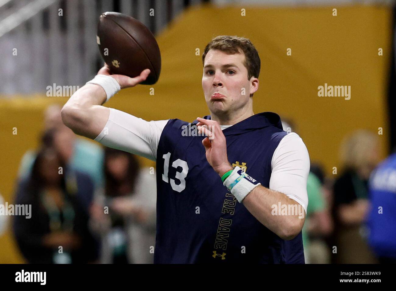 Notre Dame quarterback Riley Leonard warms up before the College