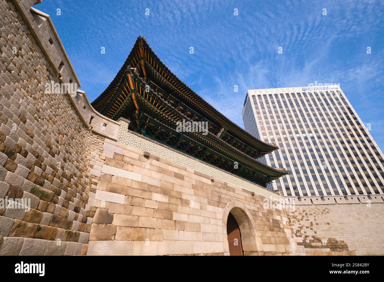 View of the gate and a modern building behind it. At the Sungnyemun ...