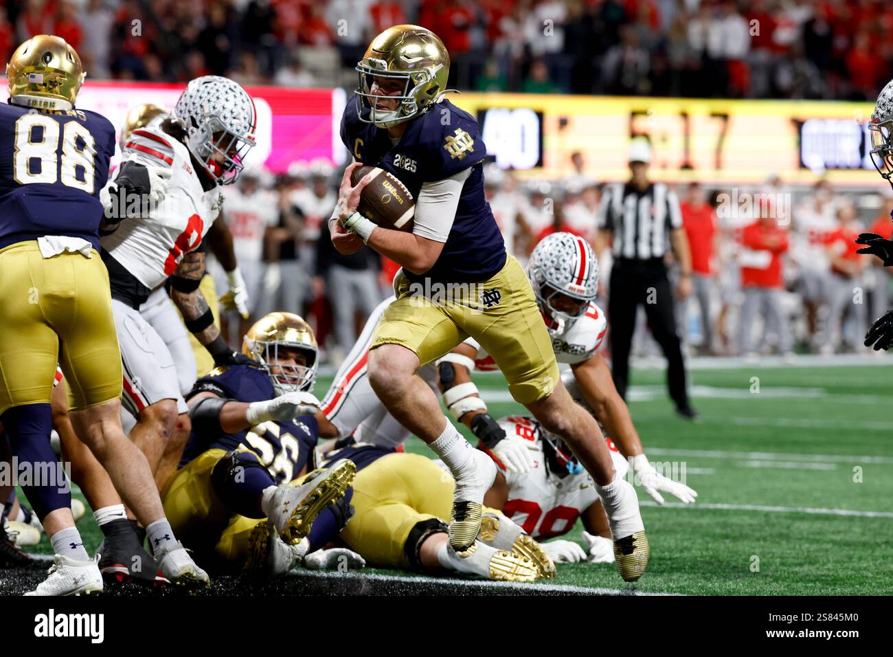 Notre Dame quarterback Riley Leonard runs for a touchdown against Ohio