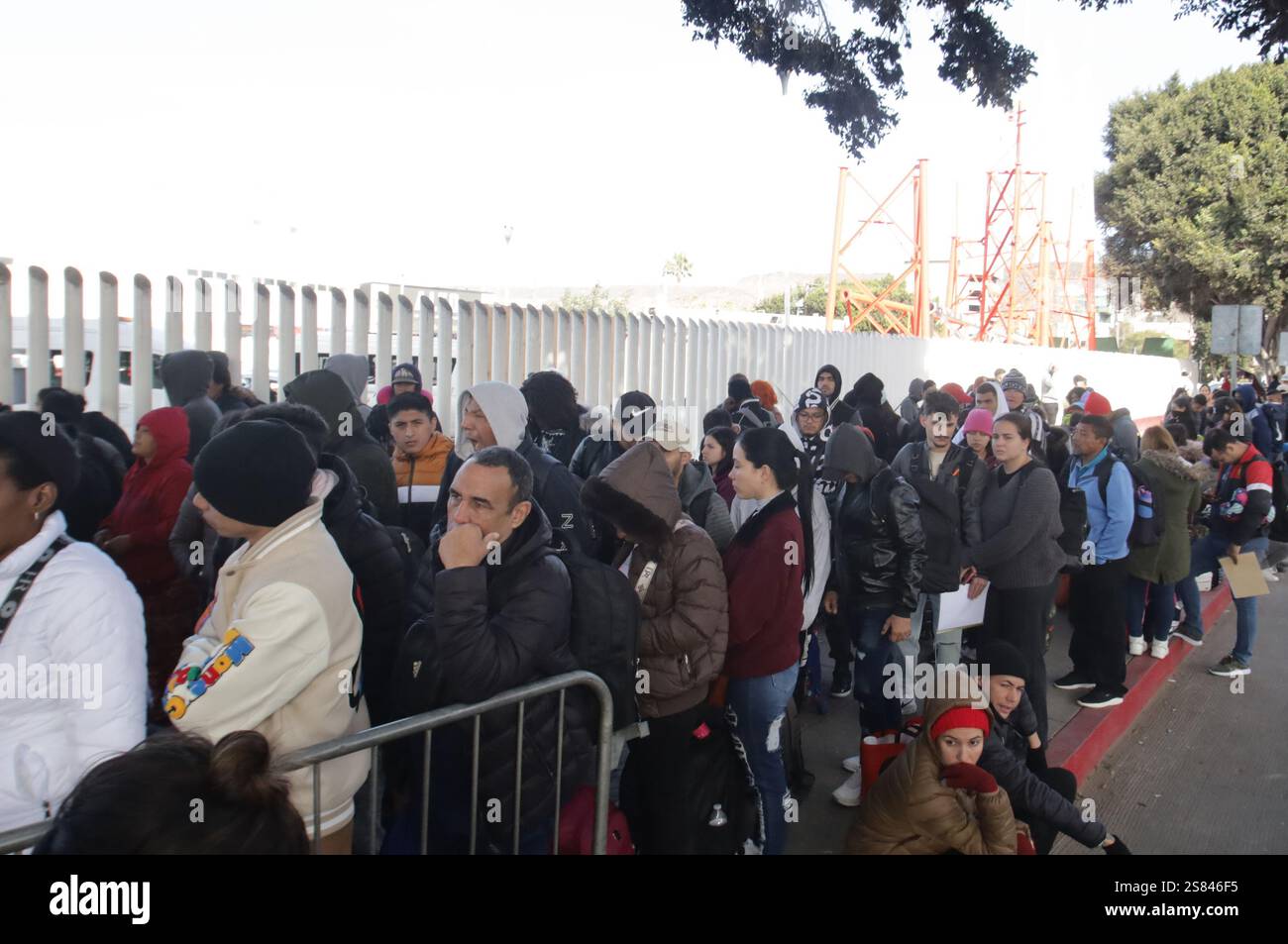 Tijuana mexico 20th jan 2025 migrants line up at the chaparral