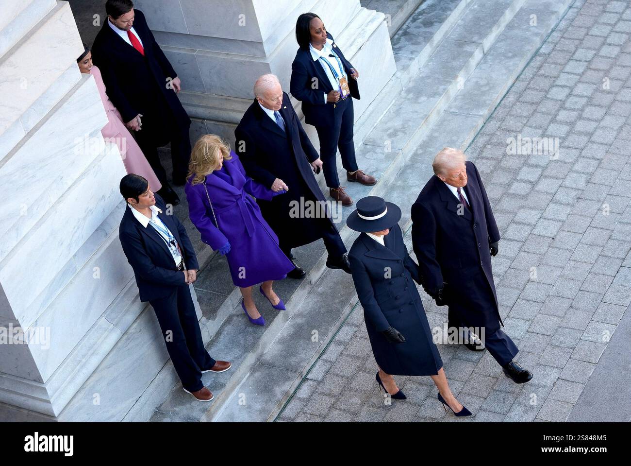 President Donald Trump, from right, and first lady Melania Trump walk to send off former